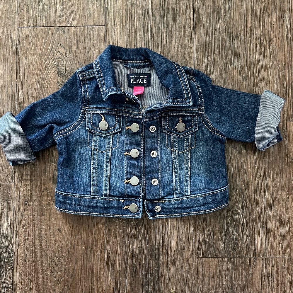 The children’s place like new girls denim jean jacket size 6-9 months.